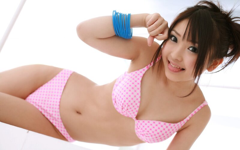 woman in pink bikini smiling