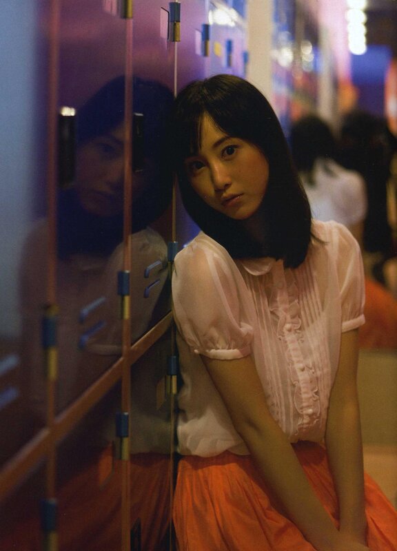 woman in pink blouse and orange skirt