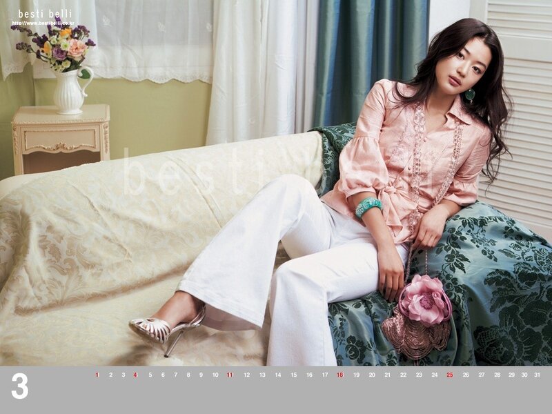 Woman in pink blouse on sofa