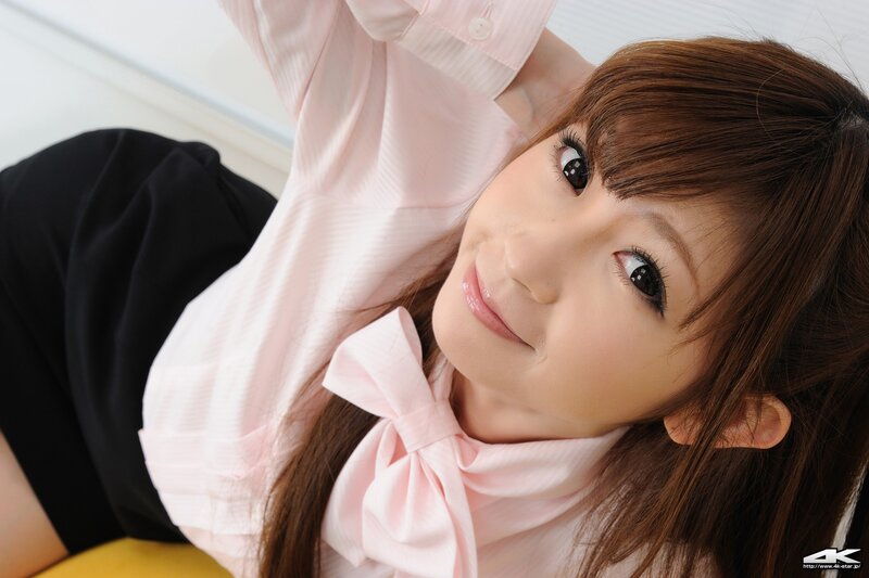 woman in pink blouse smiling