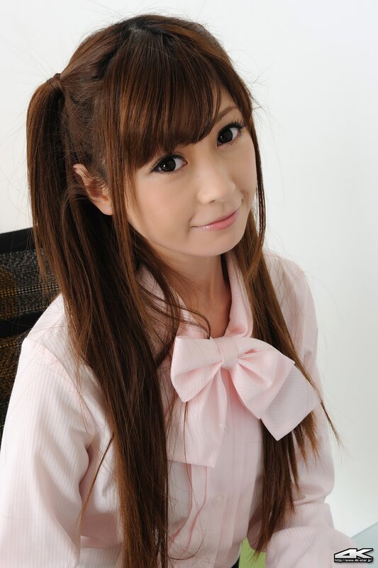 woman in pink blouse with bow