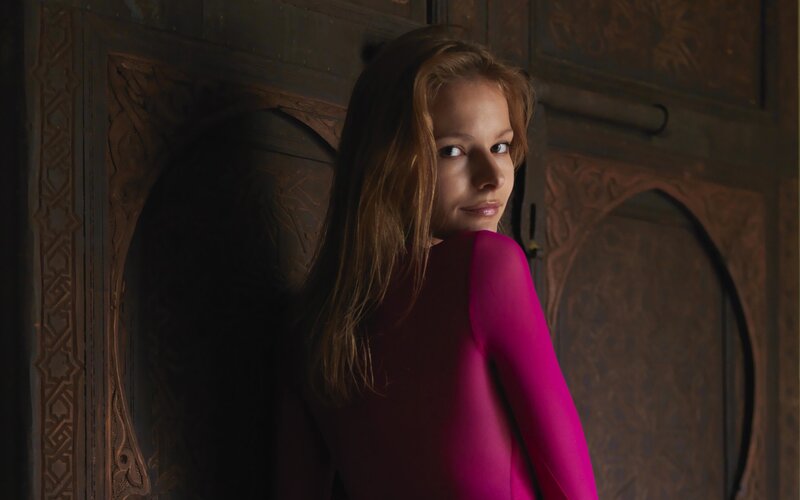 woman in pink bodysuit