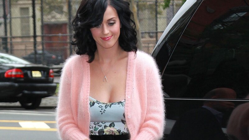 woman in pink cardigan