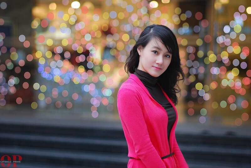 woman in pink cardigan