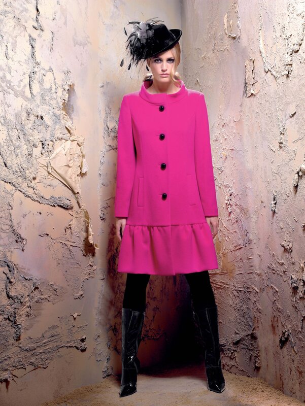 Woman in pink coat and hat