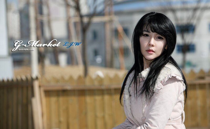 woman in pink coat outdoors