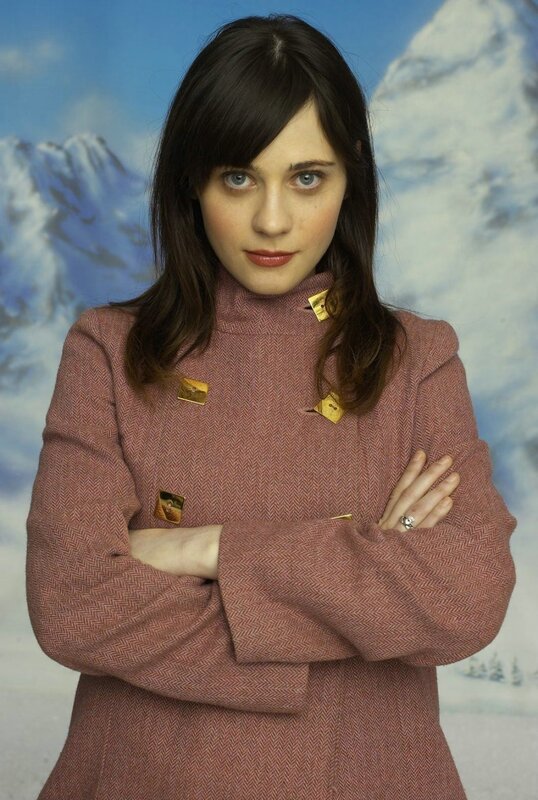 woman in pink coat with mountains