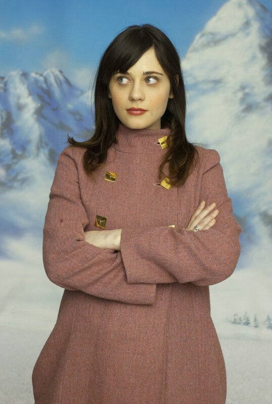 woman in pink coat with mountains