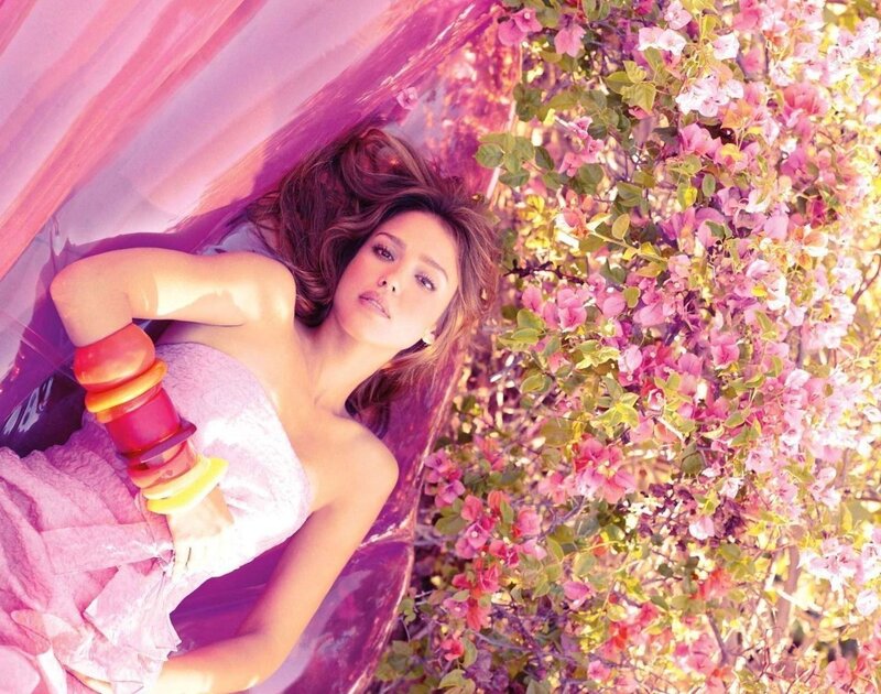 woman in pink dress among flowers
