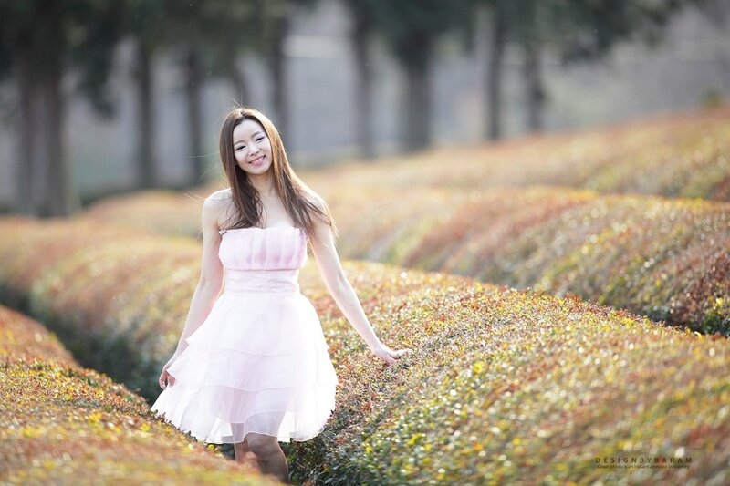 Woman in pink dress at garden