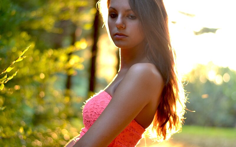 woman in pink dress at sunset