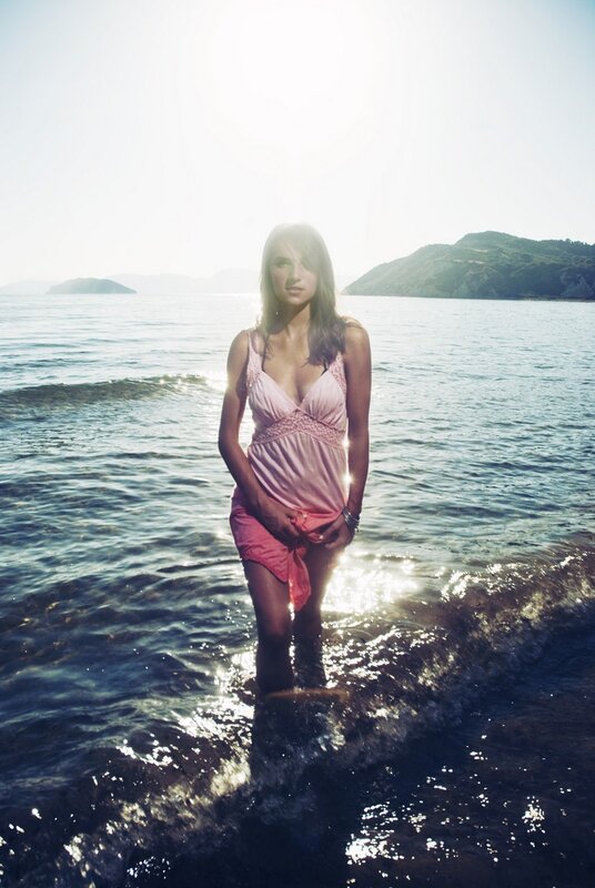 Woman in pink dress at the beach