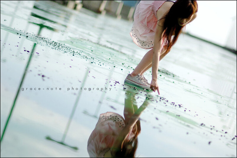 woman in pink dress by water