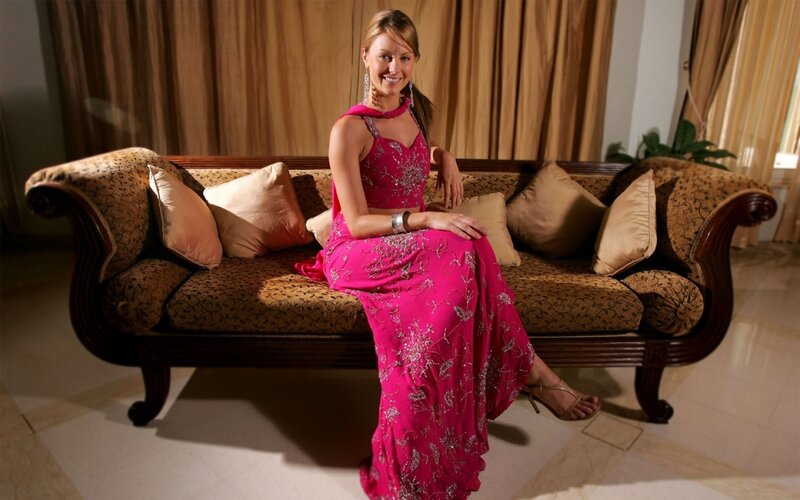 Woman in Pink Dress — Calm, Photograph, Sofa, Pillows