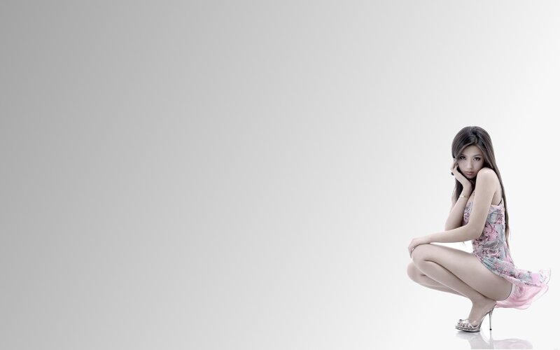 woman in pink dress crouching