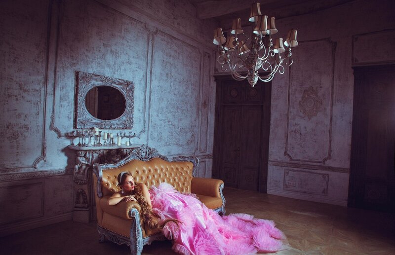 Woman in Pink Dress — Dramatic, Photograph, Chandelier, Sofa