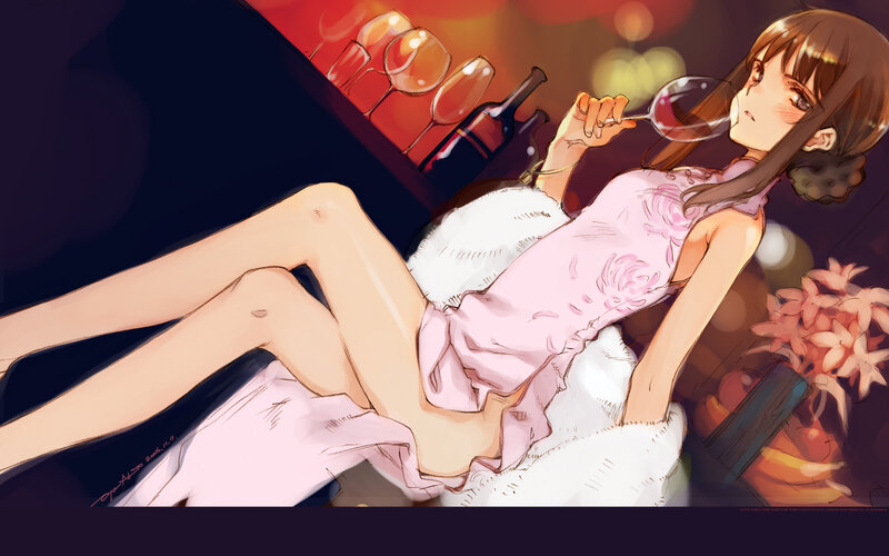 woman in pink dress drinking wine