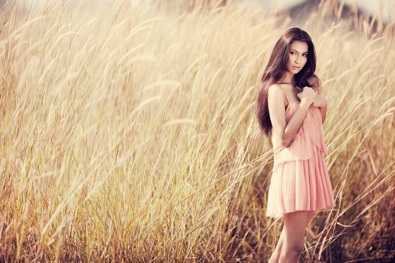 woman in pink dress in field