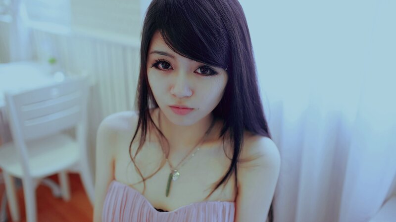 woman in pink dress looking at camera