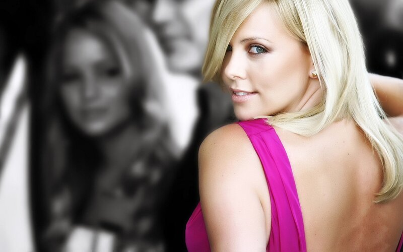 woman in pink dress looking back