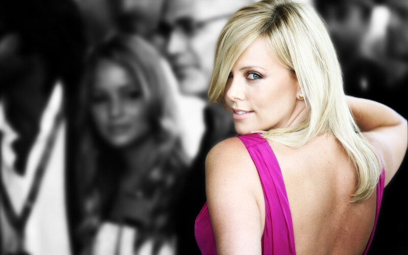 woman in pink dress looking back