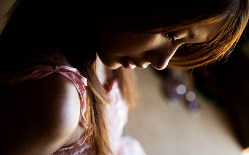 woman in pink dress looking down