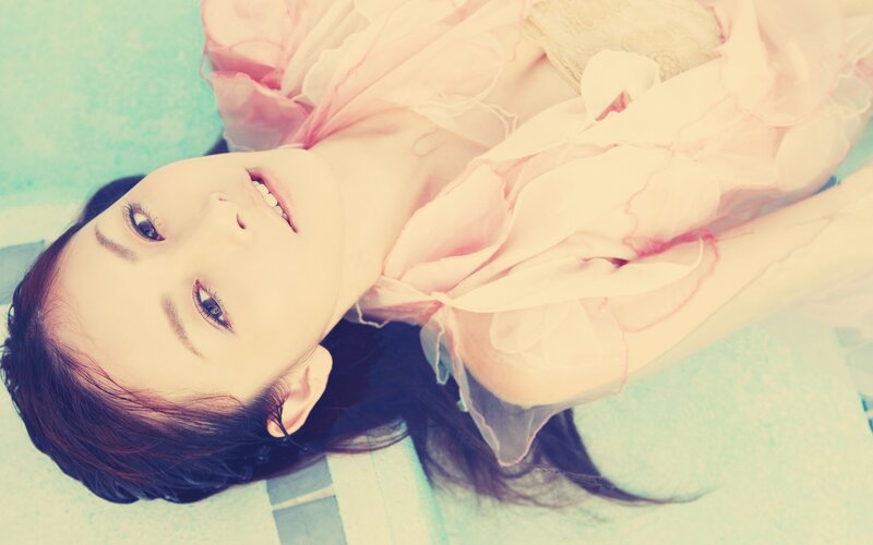 woman in pink dress lying down