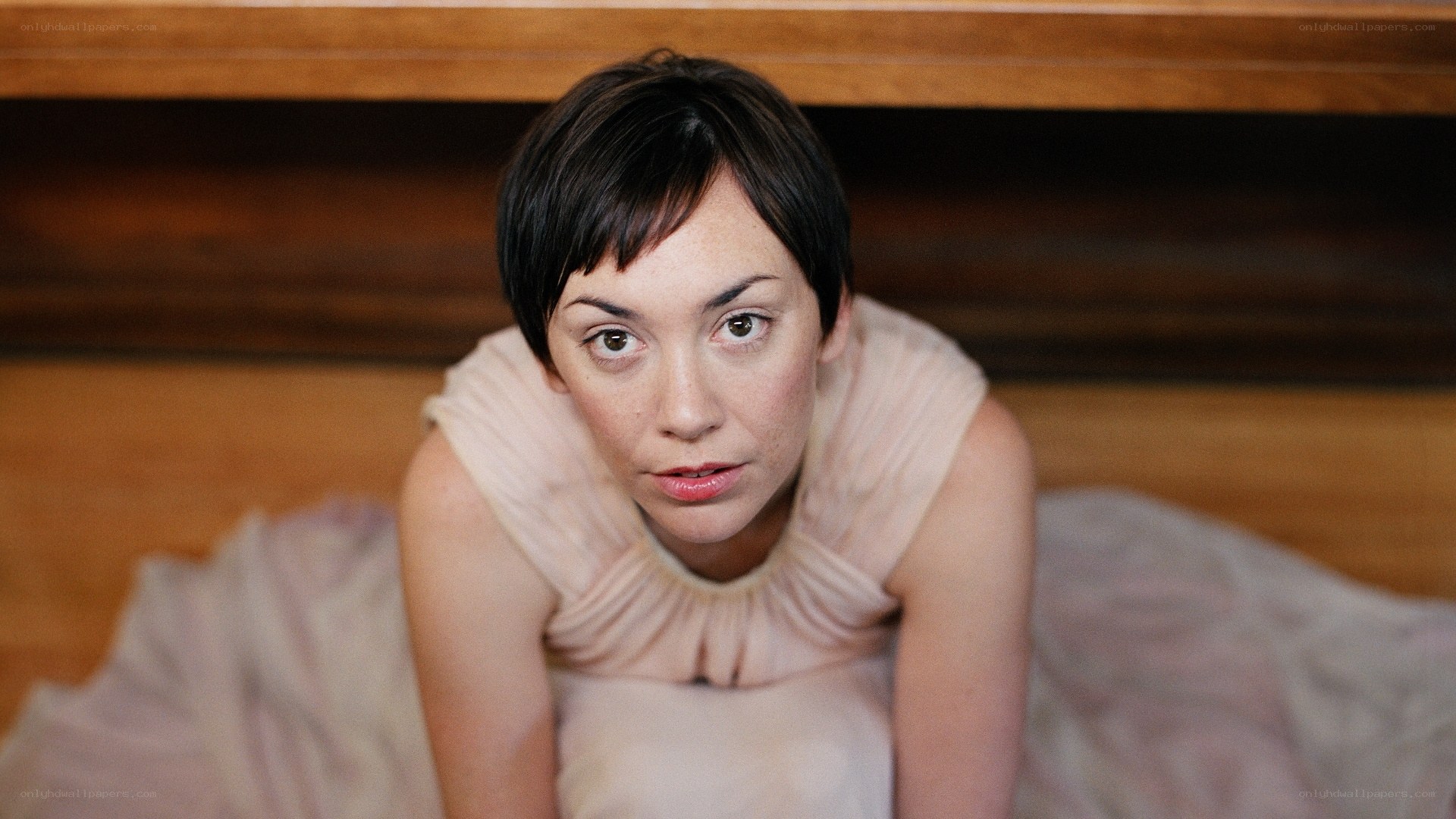woman in pink dress lying down