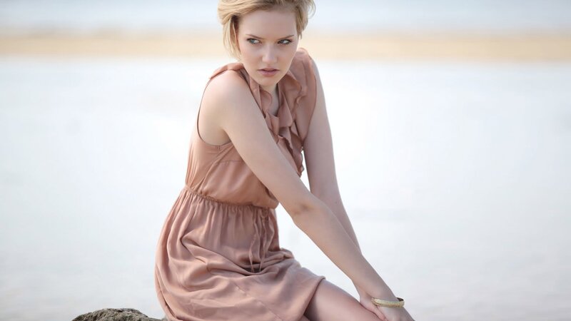 woman in pink dress on beach