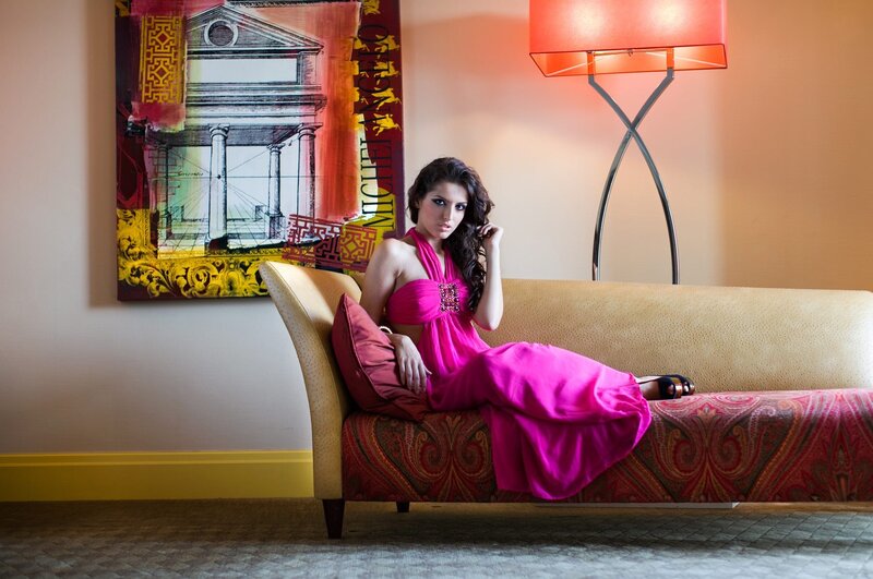 Woman in pink dress on chaise