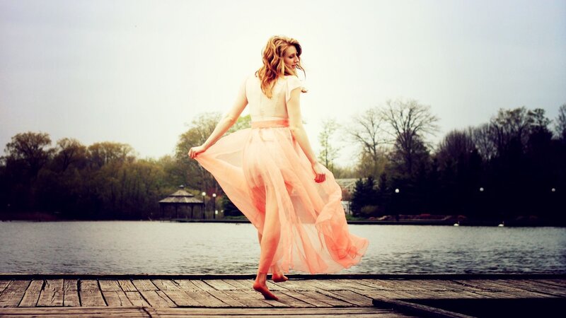 Woman in pink dress on dock