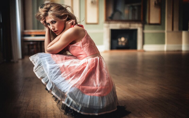 woman in pink dress on floor