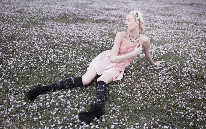 woman in pink dress on flowers