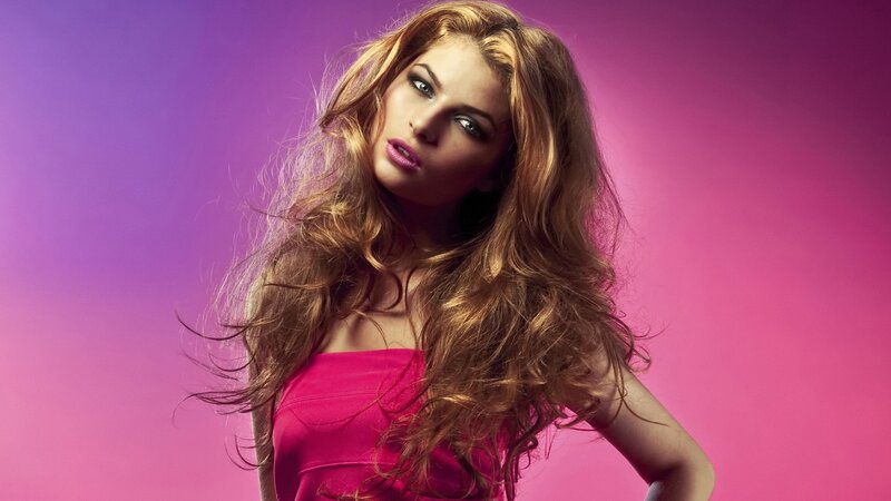 woman in pink dress on purple background