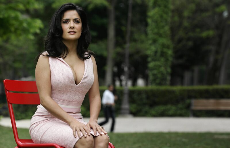 Woman in pink dress on red chair