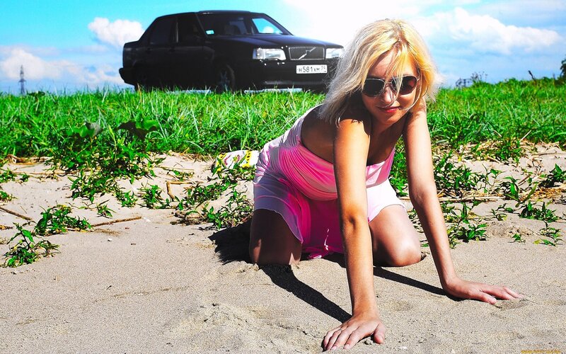 Woman in pink dress on sand