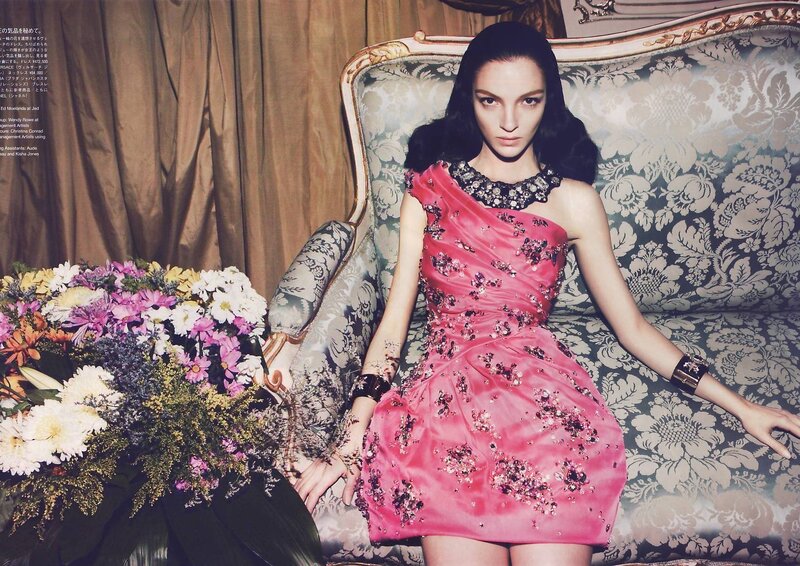 Woman in pink dress on sofa