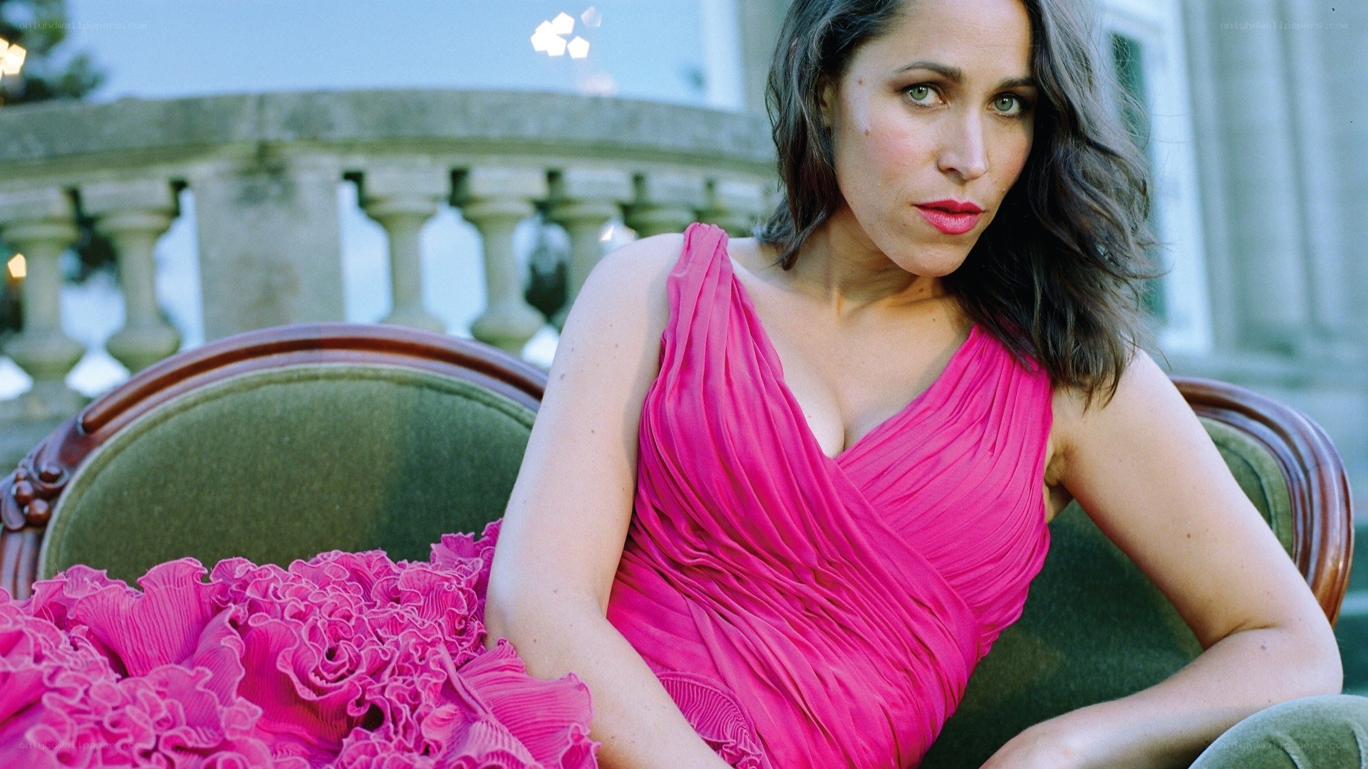 Woman in pink dress on sofa