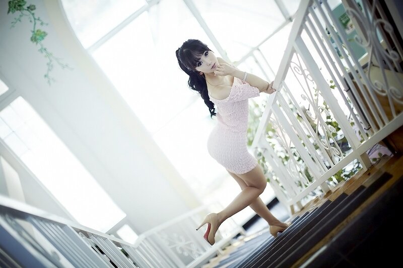 woman in pink dress on staircase