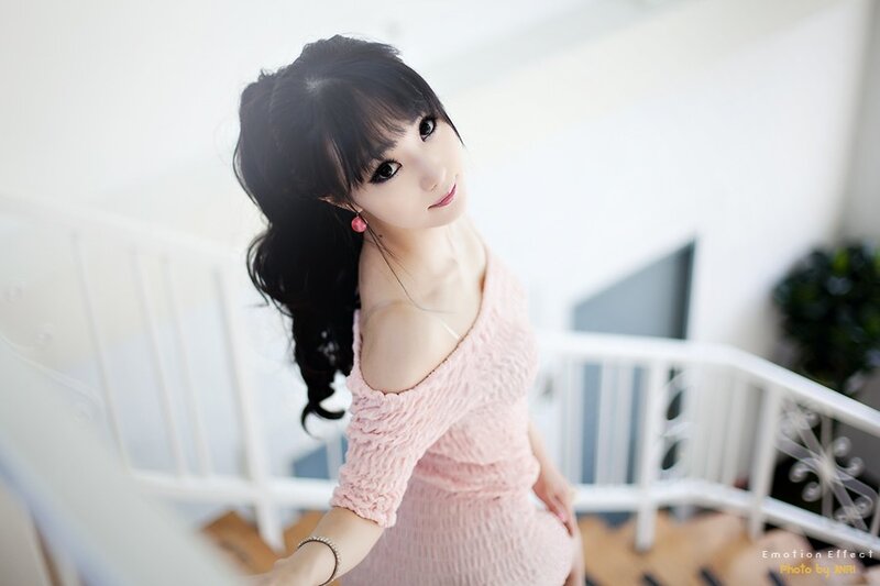 woman in pink dress on stairs