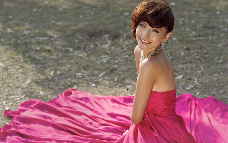 woman in pink dress smiling