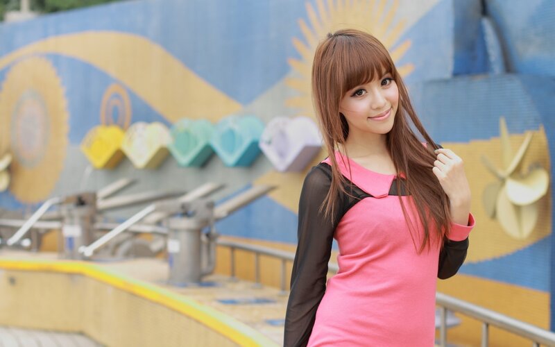 Woman in pink dress smiling