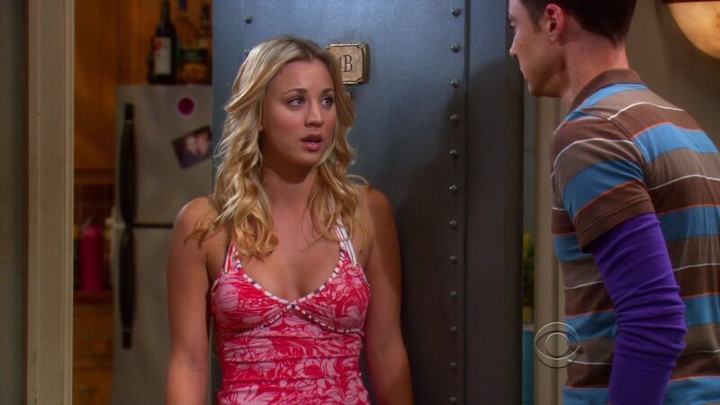 woman in pink dress talking to man