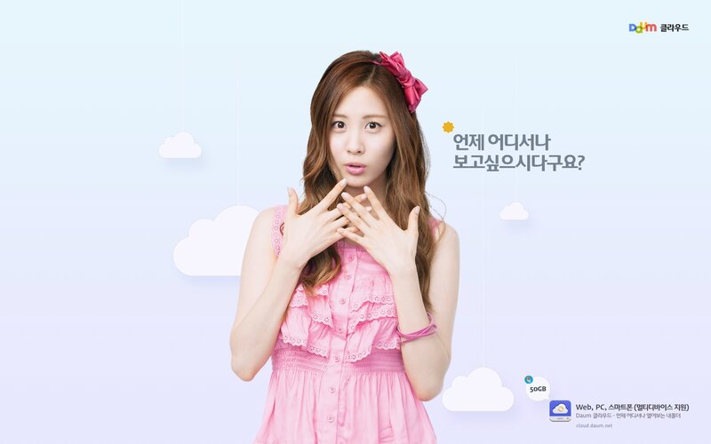 woman in pink dress with cloud background