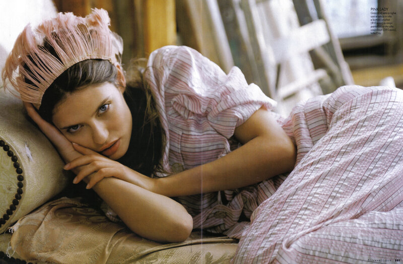 woman in pink feather headband