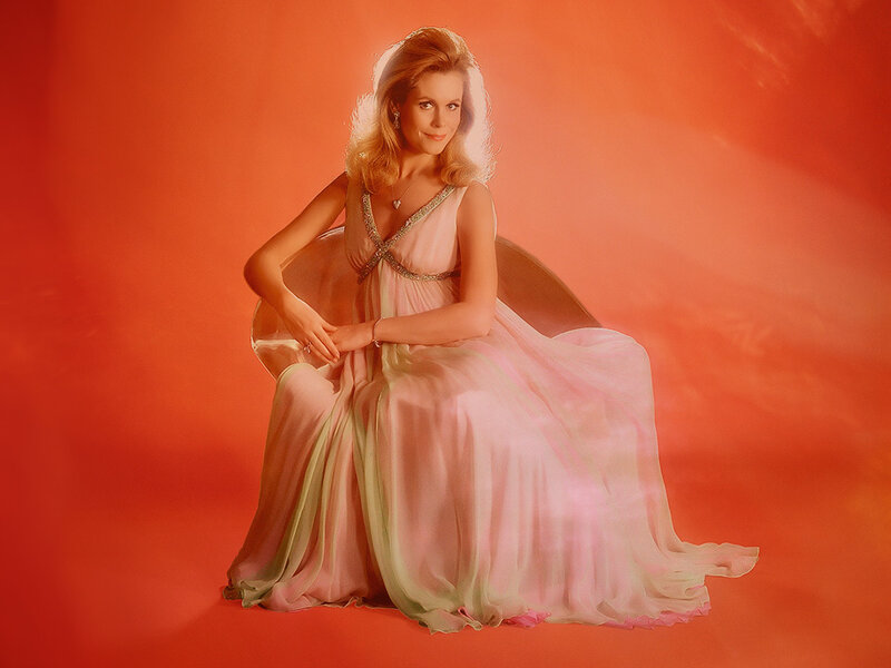 woman in pink gown on red background