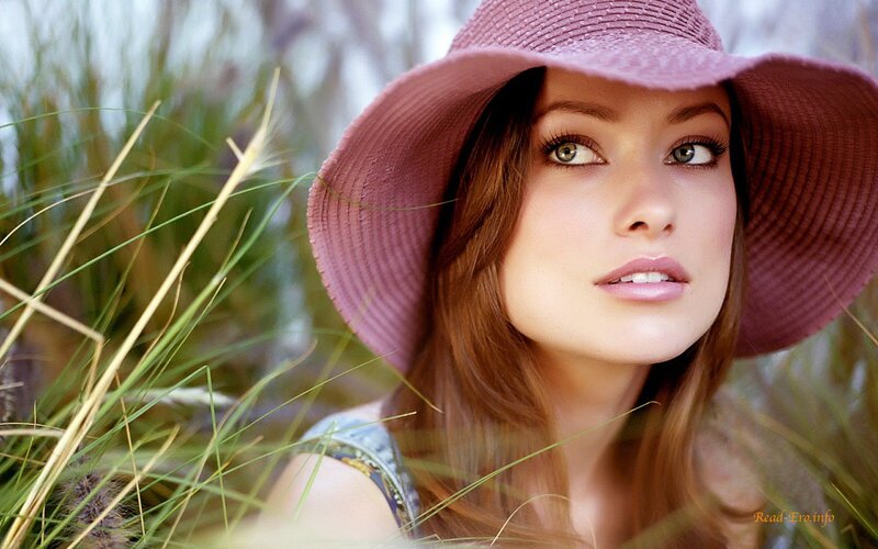 woman in pink hat among grass