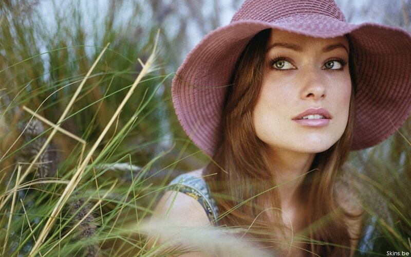 woman in pink hat among grass