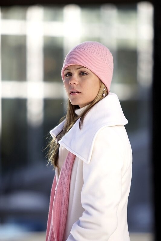 woman in pink hat and white coat