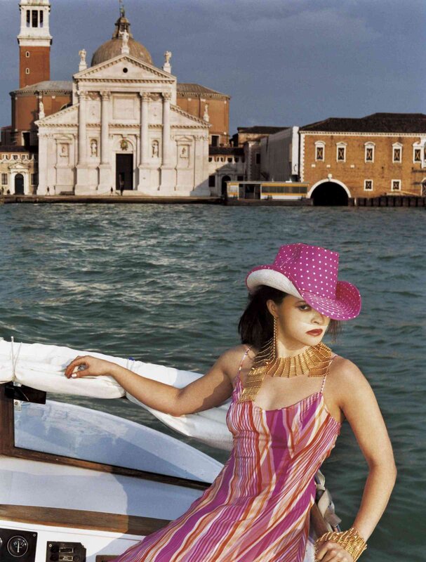 Woman in pink hat on a boat